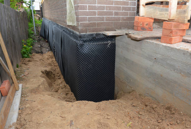 SJ Waterproofing Pros technician performing targeted Waterproofing assessment in Billingsley, AL
